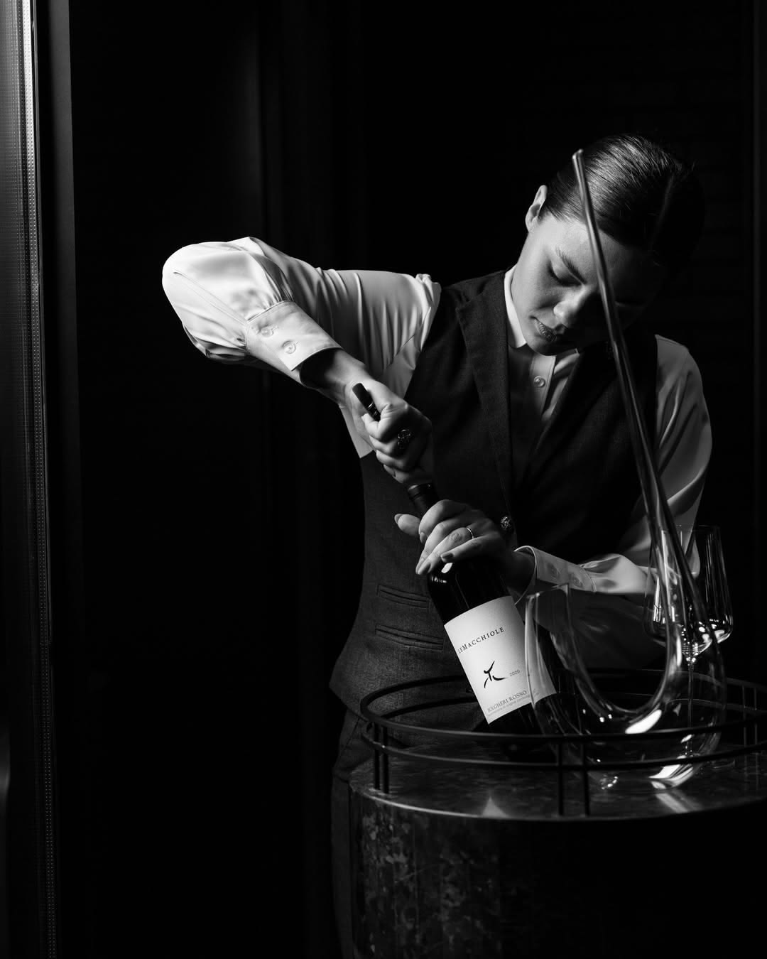 Sommelier preparing a bottle for service